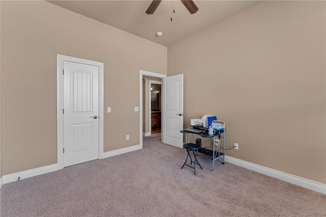 miscellaneous room featuring ceiling fan, carpet flooring, lofted ceiling, and baseboards