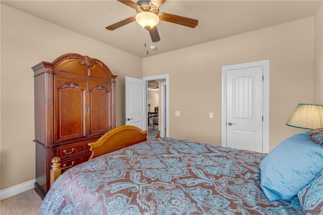 carpeted bedroom featuring ceiling fan and baseboards