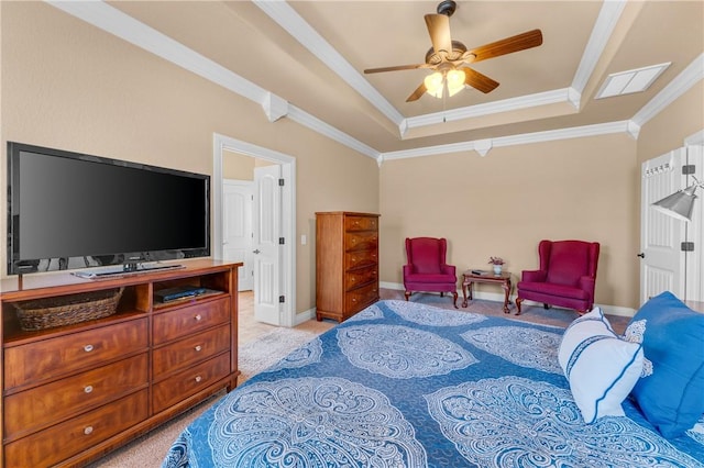 bedroom with light carpet, visible vents, baseboards, a raised ceiling, and crown molding