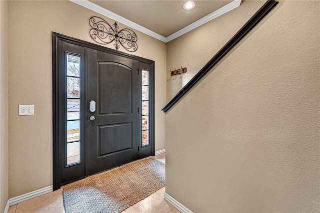 foyer entrance with crown molding, baseboards, light tile patterned floors, and recessed lighting