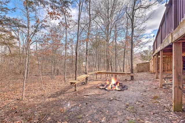 view of yard with an outdoor fire pit