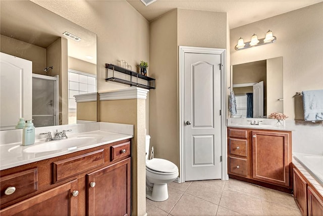 full bath with visible vents, tile patterned flooring, two vanities, a sink, and a shower with door
