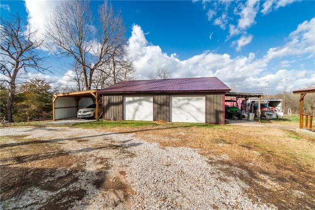 garage with a detached garage and driveway