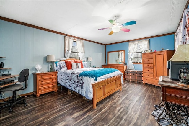 bedroom featuring multiple windows, crown molding, dark wood-type flooring, and ceiling fan