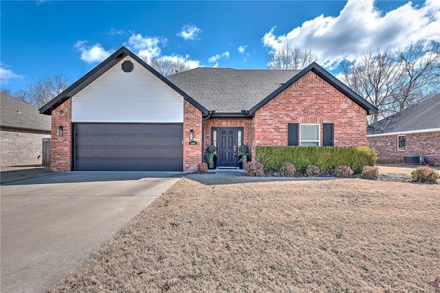 ranch-style house featuring a garage, concrete driveway, roof with shingles, central air condition unit, and brick siding