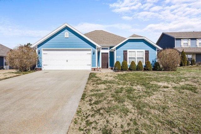 single story home featuring a garage, driveway, a front lawn, and a shingled roof