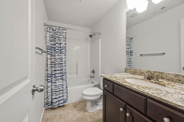 bathroom featuring toilet, tile patterned flooring, vanity, and visible vents