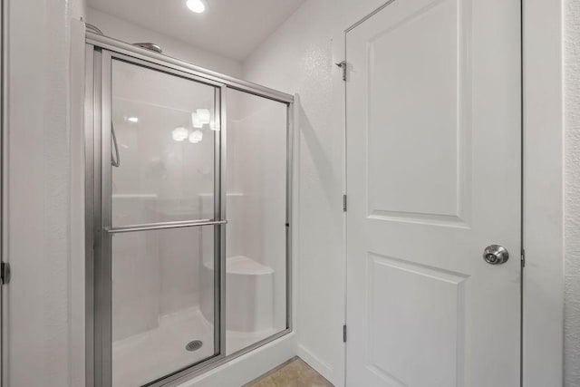 bathroom featuring a shower stall