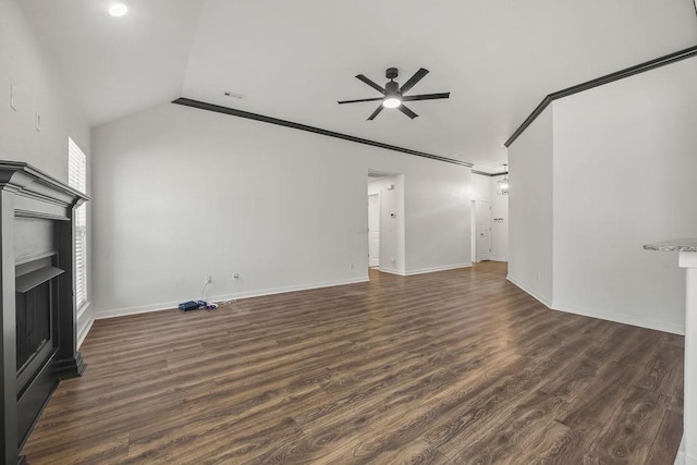 unfurnished living room with dark wood-style flooring, a fireplace, crown molding, visible vents, and a ceiling fan