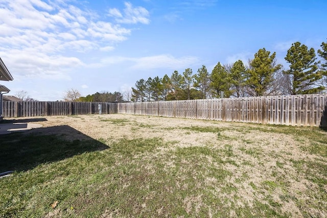 view of yard with a fenced backyard