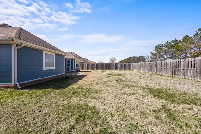 view of yard with a fenced backyard