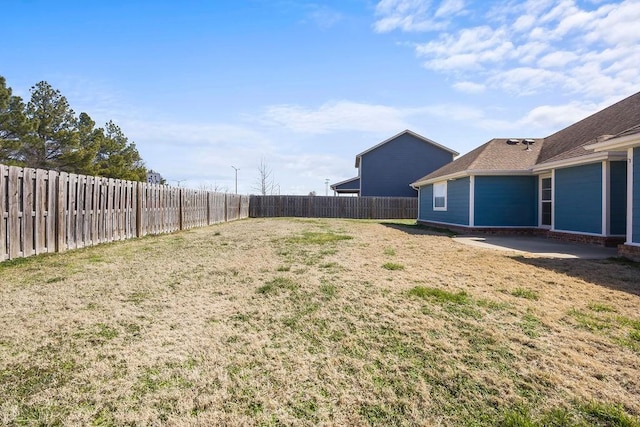 view of yard with a fenced backyard