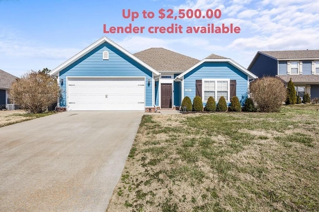 view of front of home featuring an attached garage, cooling unit, driveway, and a front yard