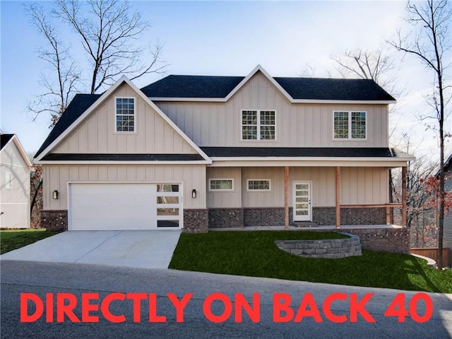 view of front of home with a garage, concrete driveway, and brick siding