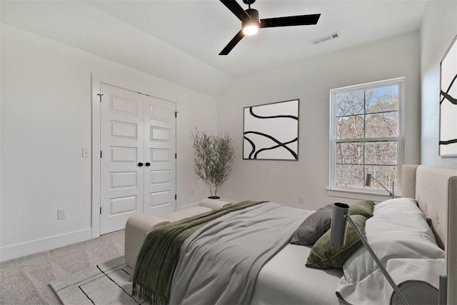 bedroom with multiple windows, carpet flooring, visible vents, and baseboards