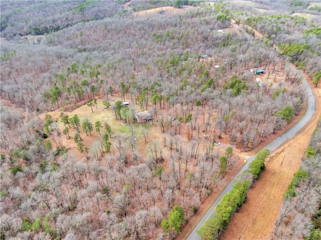 birds eye view of property with a forest view