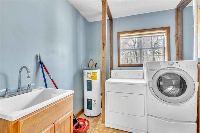 laundry area with light tile patterned floors, electric water heater, a sink, washer and dryer, and cabinet space