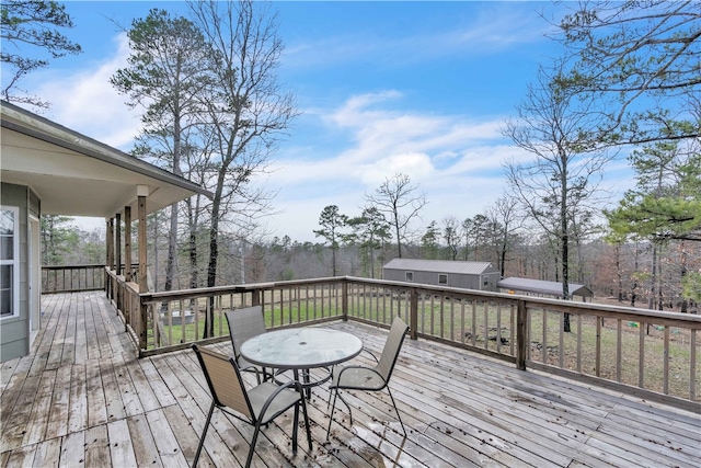 wooden deck with outdoor dining area