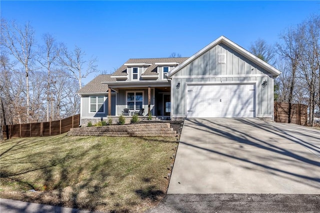 view of front of house with concrete driveway, an attached garage, covered porch, fence, and board and batten siding