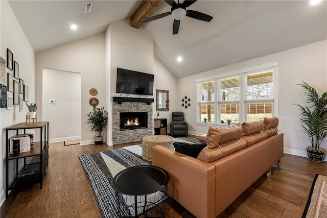 living area with high vaulted ceiling, a stone fireplace, visible vents, beam ceiling, and dark wood finished floors