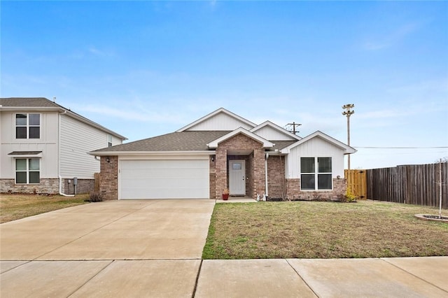 view of front facade with concrete driveway, an attached garage, fence, a front yard, and brick siding