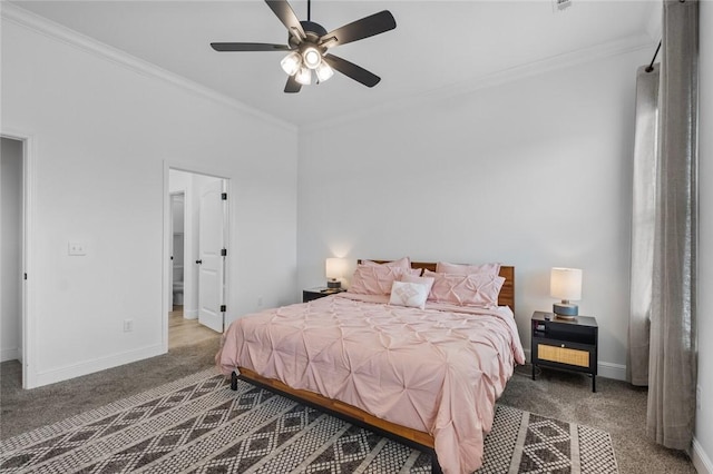 carpeted bedroom with a ceiling fan, crown molding, and baseboards