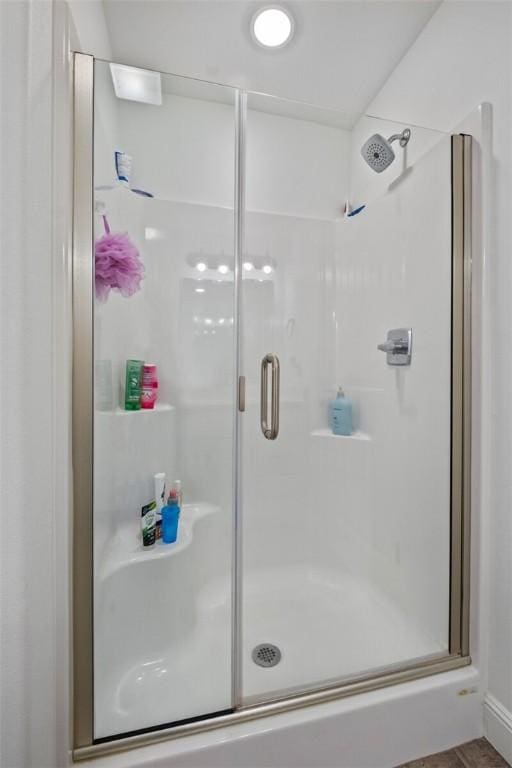 full bath with a shower stall