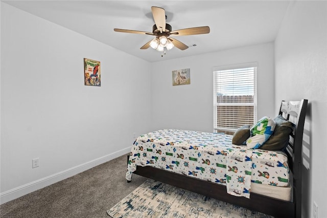 carpeted bedroom featuring ceiling fan and baseboards