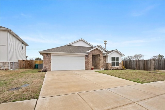 single story home featuring an attached garage, brick siding, fence, driveway, and a front yard