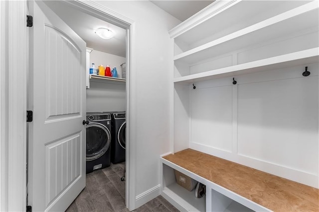 mudroom with washer and clothes dryer and wood finished floors