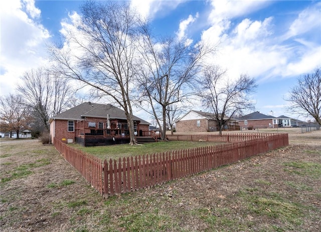 view of yard featuring fence private yard and a wooden deck