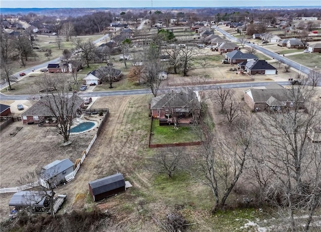 birds eye view of property with a residential view