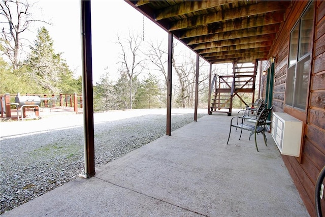 view of patio / terrace featuring stairway