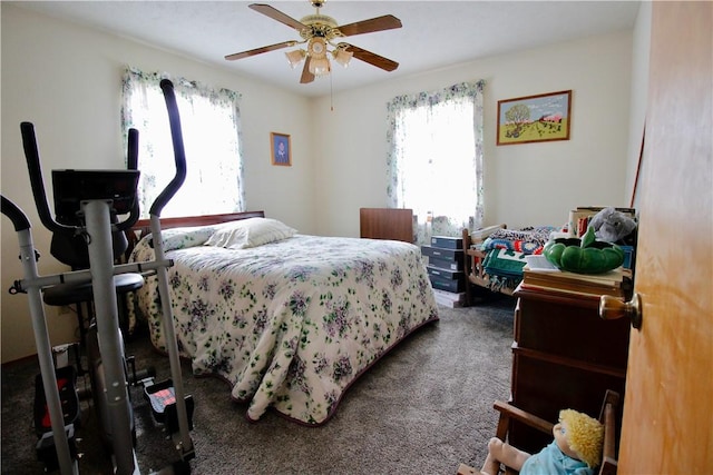 bedroom featuring ceiling fan and carpet