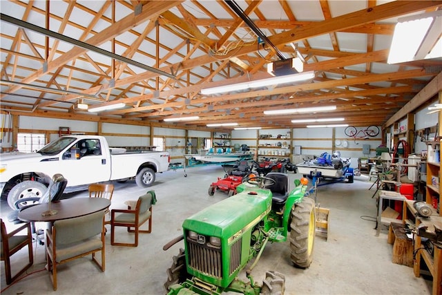 garage featuring a garage door opener and a workshop area