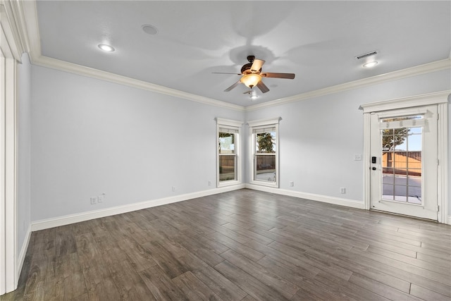 empty room featuring ceiling fan, dark wood-style floors, baseboards, and ornamental molding