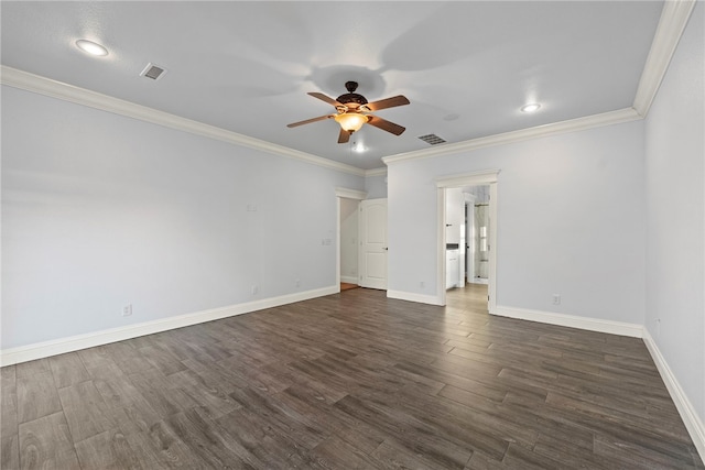 spare room with visible vents, dark wood-type flooring, a ceiling fan, and ornamental molding