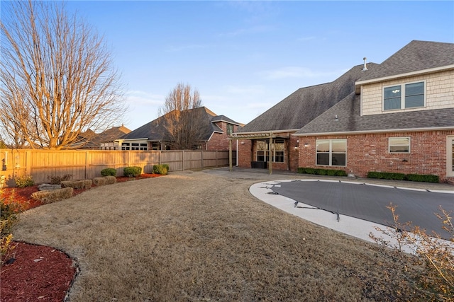 view of yard with a fenced backyard and a patio area