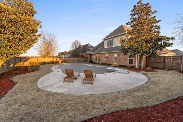 view of pool with a patio and a fenced backyard