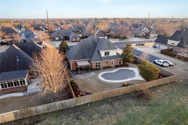 birds eye view of property with a residential view