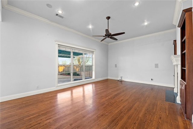 unfurnished living room featuring dark wood finished floors, visible vents, baseboards, and ornamental molding