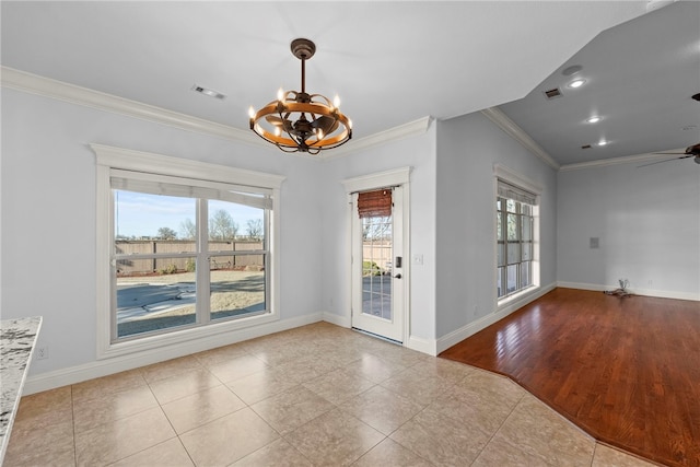 unfurnished dining area with crown molding, baseboards, and visible vents