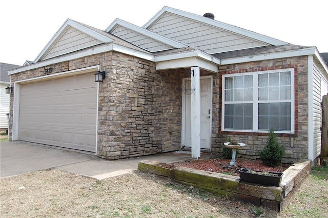 view of front facade with a garage, stone siding, and concrete driveway