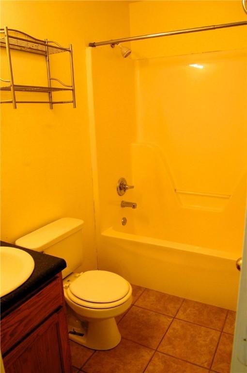 full bath featuring toilet, shower / bath combination, vanity, and tile patterned floors