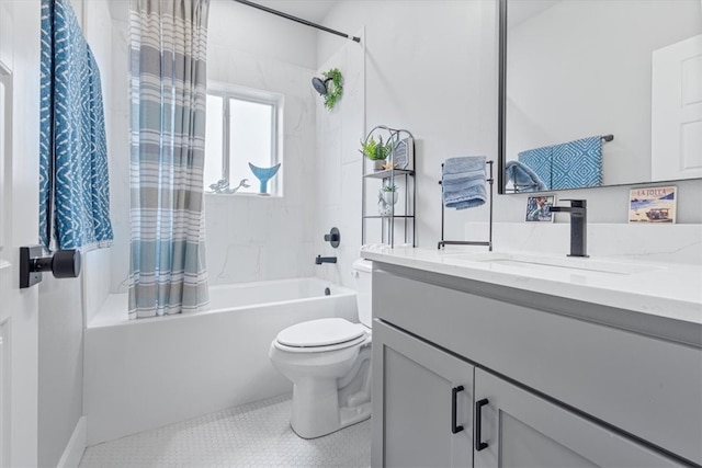 bathroom featuring toilet, shower / bath combo, and vanity