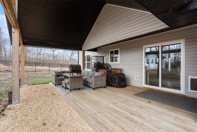 wooden deck featuring fence and an outdoor living space