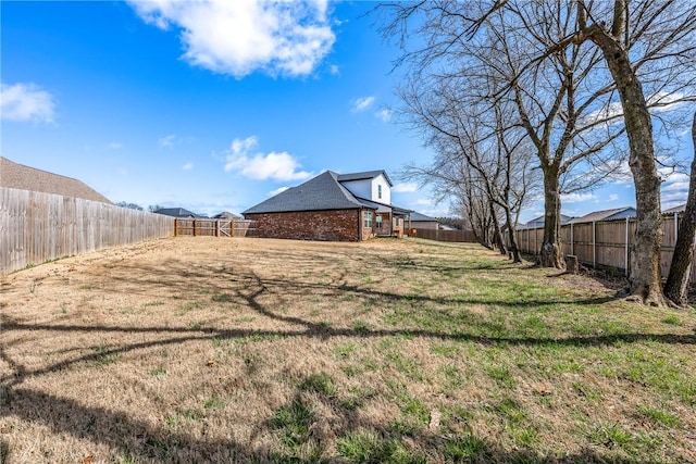 view of yard featuring a fenced backyard