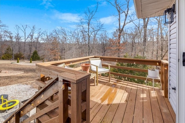 wooden terrace with a forest view