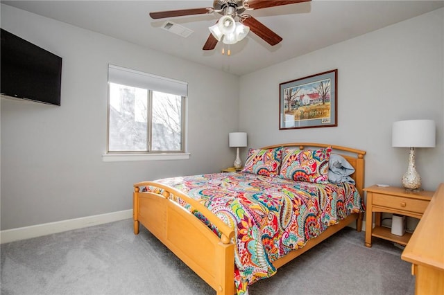 bedroom featuring carpet floors, visible vents, ceiling fan, and baseboards