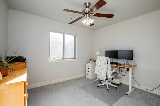 carpeted office featuring a ceiling fan, visible vents, and baseboards